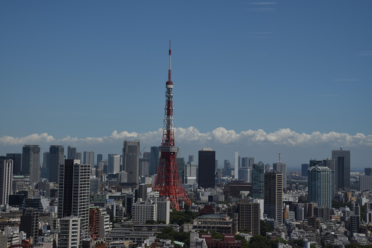 Book flights to Japan - Tokyo Tower and skyline - international airline tickets